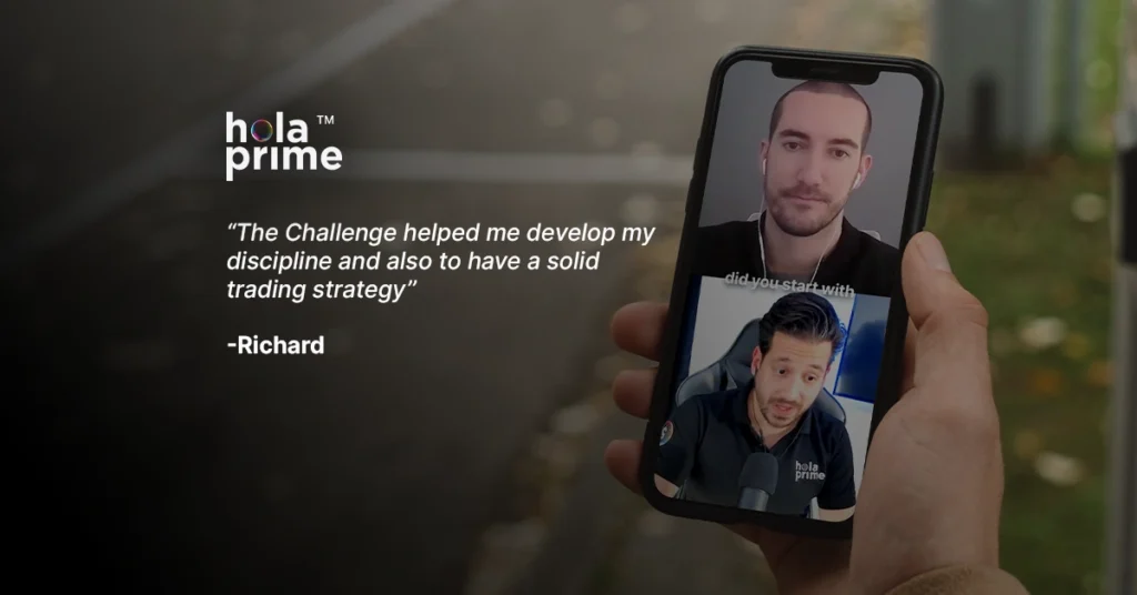 Close-up of a hand holding a phone showing a video call between two men with a hola prime logo on side.