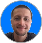 Day trader with a friendly smile in front of a blue background; represents prop firms, funded trading accounts